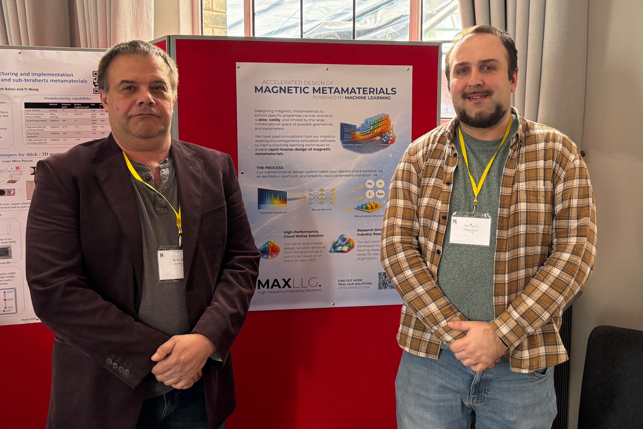Our Chief Scientific Officer, Prof. Feodor Ogrin (left), and our researcher for the inverse design project and software engineer, Dr Sam Morrell (right), stood in front of our poster at the Metamasterials Manufacturing Conference.